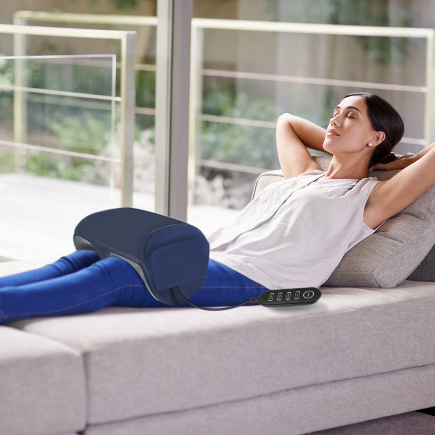Shiatsu foot and calf massager with heat, enclosed chamber design, and digital controls in a modern home setting.