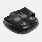 Compact heated foot massager with textured footbed and digital control panel in a modern home setting.