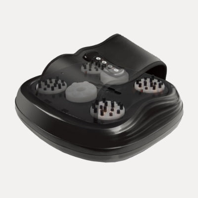 Compact heated foot massager with textured footbed and digital control panel in a modern home setting.
