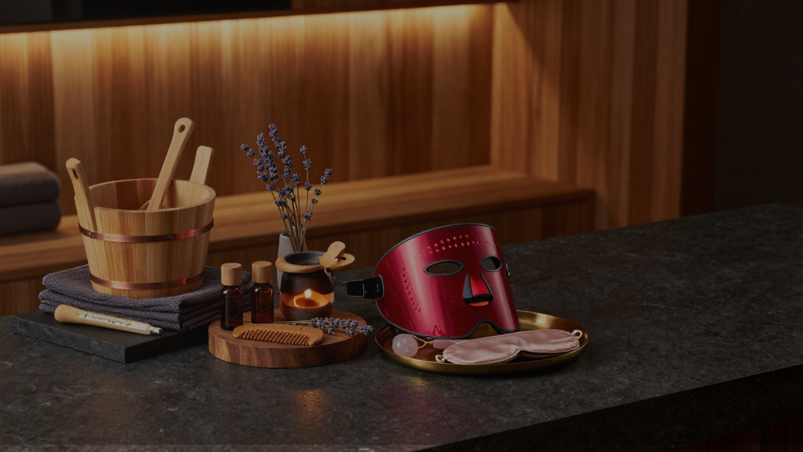 Premium wellness bundles and recovery kits arranged with sauna accessories, red light therapy, aromatherapy, and spa essentials for home sanctuary rituals.