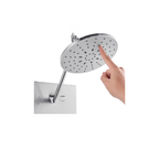 Functional detail of the Aurora III circular rainfall canopy, showcasing the articulating swivel joint and high-efficiency silicone nozzles in brushed 304 stainless steel.