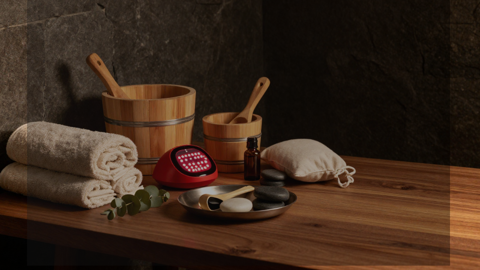 Premium recovery accessories for sauna, red light therapy, and daily wellness rituals in a luxury home sanctuary setting.